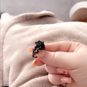 Black Onyx Ring Surrounded by Purple Stones !
